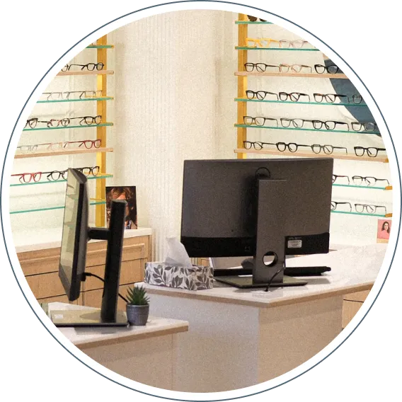 Optical showroom with eyeglass frames and optometry service desk