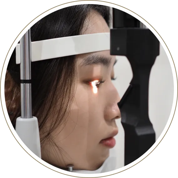 Patient receiving slit lamp eye exam close-up