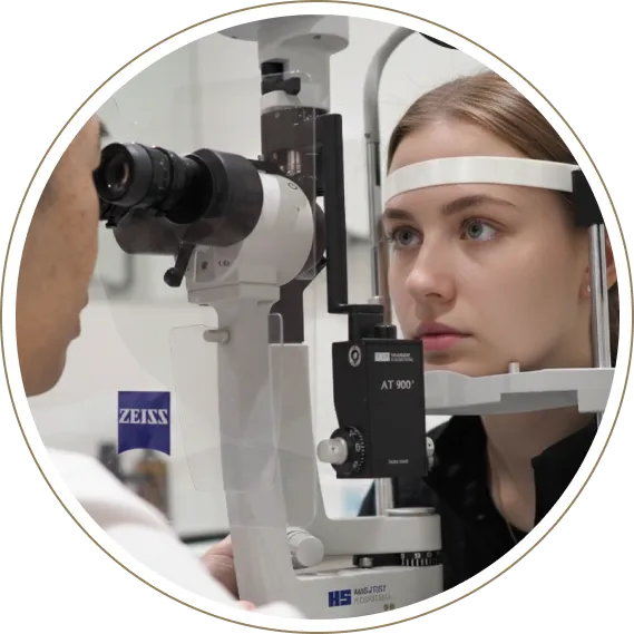 Patient undergoing slit lamp eye examination