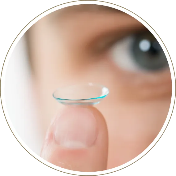 Person holding contact lens for clear, comfortable vision correction