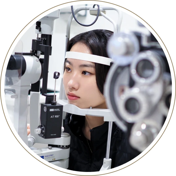 Patient having an eye exam with a slit lamp microscope clinic