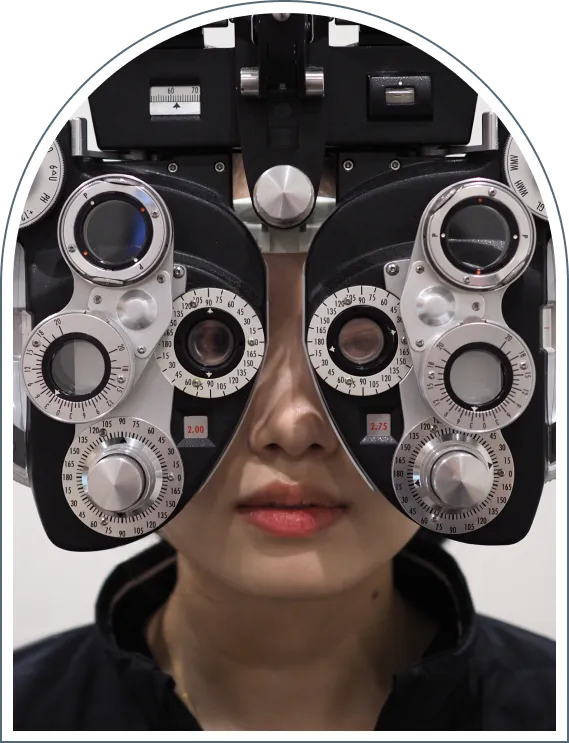 Patient undergoing vision test using a phoropter eye exam
